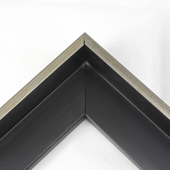 This Medium, L-shaped floating contemporary canvas frame in matte black features a thin brushed Silver face.

*Note: These solid wood, custom canvas floaters are for stretched canvas prints and paintings, and raised wood panels.