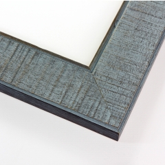This wide 2-1/4 " aged frame comes in a cool blue finish. The wooden frame features a distressed vertical texturing along the face of the profile to accentuate the natural wood grain undertone for a vintage appearance. The inside and outside edge of the profile use a deeper blue shade to create a border.
