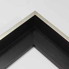 This silver foil floater frame features a thin 5/16" profile with a 1-5/8" depth. This modern frame creates a sleek, elegant appearance.