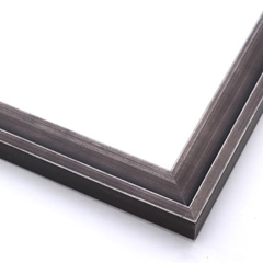 This simple, stepped profile frame features solid wood overlaid with a blackened silver foil.  This heavy antiquing gives the otherwise plain frame a classic, charcoal look.  

1.125 " width: ideal for small images.  Border a family photograph, or a painting or print with this unique frame.