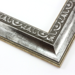 This classic, Victorian-style frame features a solid wood, reverse scoop profile.  The relief-detailed inner lip and sloped face are a textured silver foil, edged in a subtle bevel.

2 " width: ideal for medium size images. Border an acrylic or oil painting or print with this antiqued, high fashion frame.