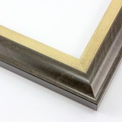 This solid wood frame features an elegant curve-and-scoop profile that draws the eye inward.  The outer edge maintains the natural wood grain, and slightly distressed gold foil on the inner lip adds a subtle antique finish. The outside rim is an unobtrusive black.

1.75 " width: suitable for both medium and large images.