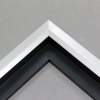 Unique geometric 1 " floater. The face of this molding features an off center peak which gives it a unique contrast in the right lighting.  This frame comes in Matte White with a dull satin finish.