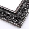 This ornate, intricate frame features a bold relief design in a black-mottled antique silver foil. The raised, roughly textured inner lip is silver foil as well.

2.75 " width: ideal for large images.  Select a strong piece of artwork to avoid it being overpowered by this decadent frame.