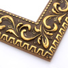 A large, reverse curve profile frame with an intricate leaf design bordered by a geometric outer edge and beaded inner lip.  A dark, matte gold-brown base with gold foil patina for added depth on the topmost points of the design. Strong, solid wood construction.

2.75 " witdth: ideal for large and oversize (extra large) images.