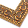 A large, reverse curve profile frame with an intricate leaf design bordered by a geometric outer edge and beaded inner lip.  A matte and gold foil base features bronze patina for added depth on the topmost points of the design. Strong, solid wood construction.

2.75 " width: ideal for large and extra large images.