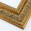 This highly detailed gold leaf frame features a wide, reverse stepped profile with three distinct designs.  A brushed effect reveals a deep red undercoat and gives the frame an antique appearance.

3 " width: ideal for large and oversize images.  This frame can hold its own against a detailed painting or print, but may overshadow a simpler image.