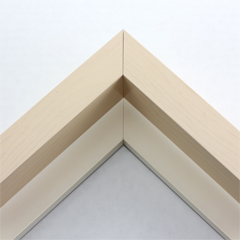 This large, L-shaped floating contemporary canvas frame in natural tone features a wide flat face.

*Note: These solid wood, custom canvas floaters are for stretched canvas prints and paintings, and raised wood panels.